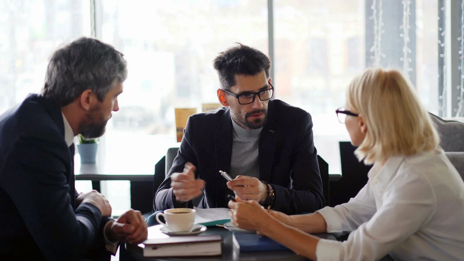 A group of people have a business meeting