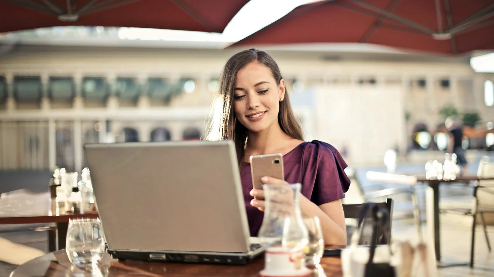 Woman Wearing Purple Shirt Holding Smartphone White Sitting on Chair