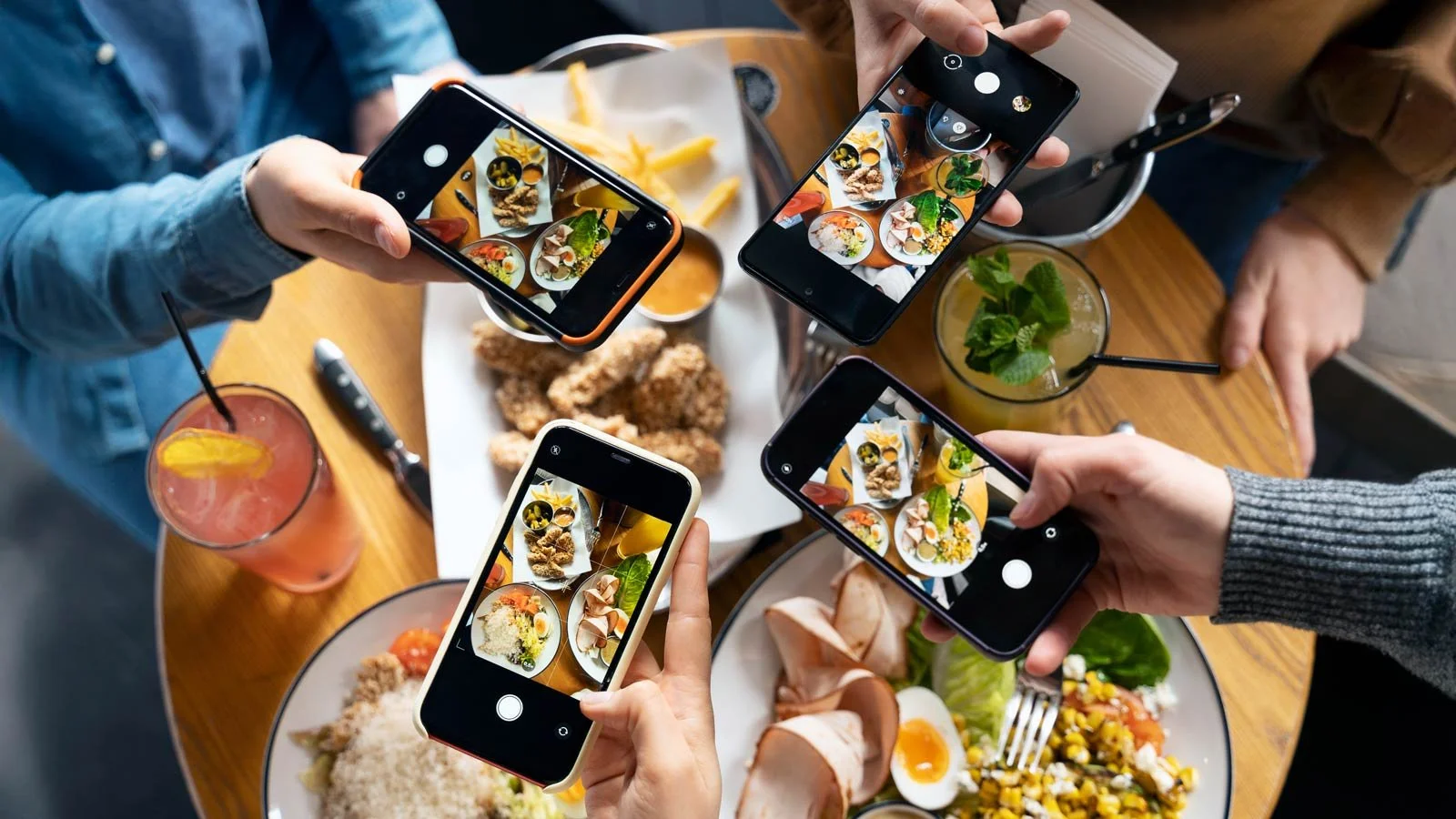 People taking photos of food