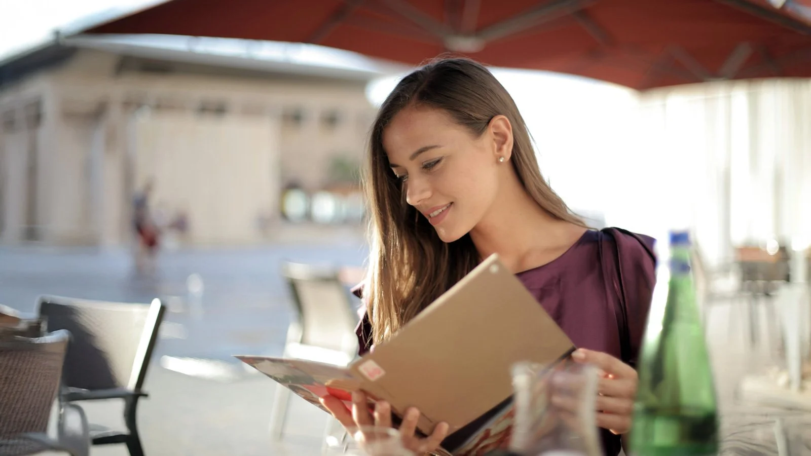 Woman in Purple Top Reading Menu